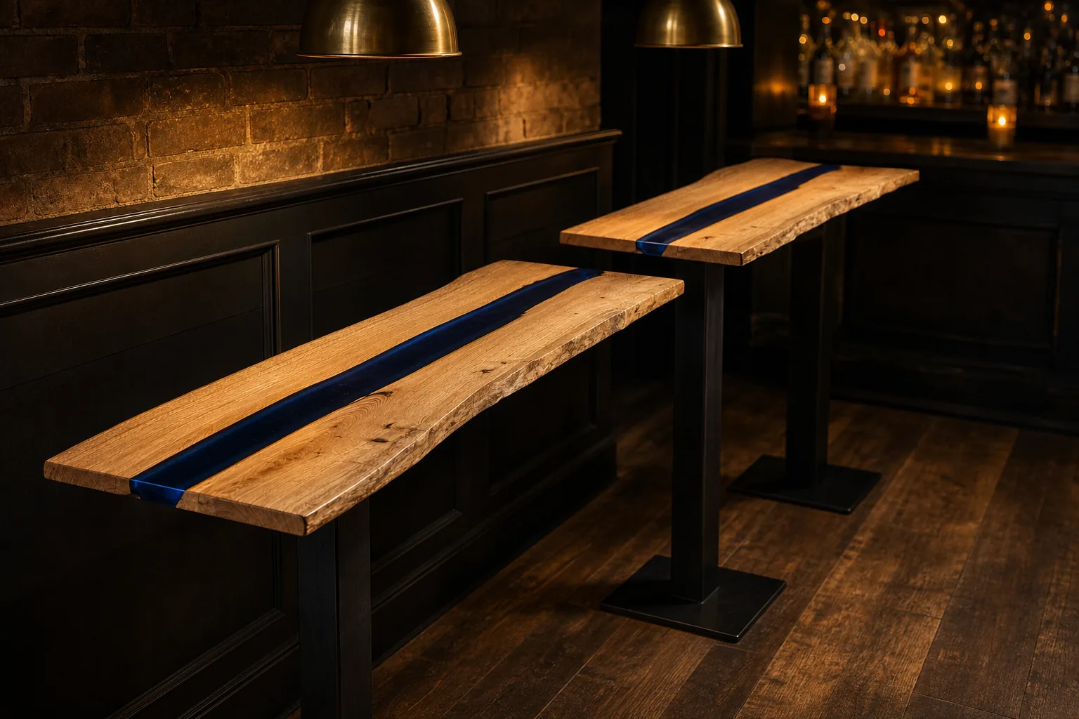 Pair of Headwater bar tables in service at a Bend, Oregon bar, navy resin channels under pendant light